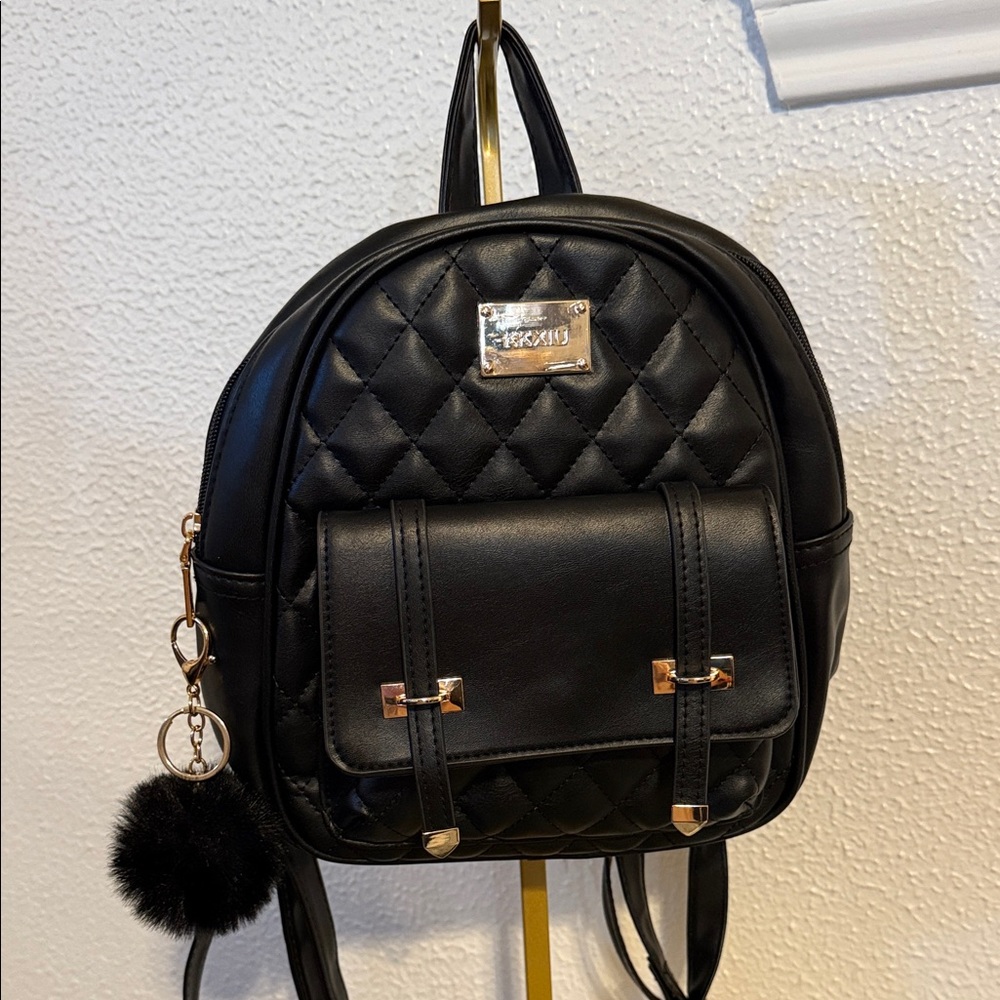 Elegant Black Quilted Backpack with Gold Details